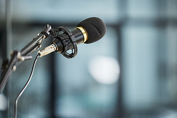 Image showing Conference, auditorium and microphone in an office for a speech, work event or presentation. Bokeh, business and a mic or gear for a meeting, workshop speaker or a corporate seminar at the workplace