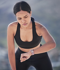 Image showing Running, woman and check smart watch outdoor for time, heart rate and fitness. Sports runner, workout and clock on stopwatch tech for performance app, exercise progress and results of cardio training