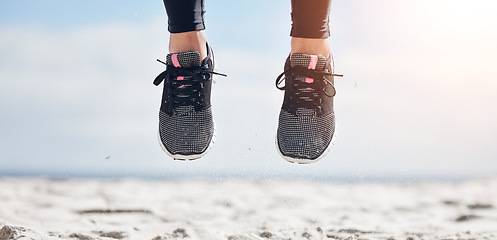 Image showing Woman, fitness and shoes jumping on mockup in air for sports motivation, running or outdoor exercise. Closeup of female person, athlete or runner feet jump in workout for healthy wellness or training