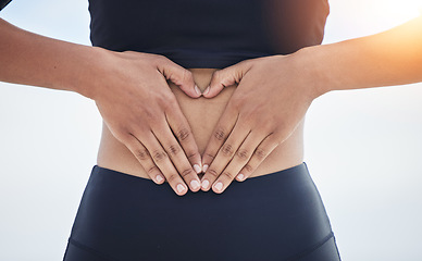 Image showing Woman, heart and hands on stomach for fitness, weightloss diet and gut wellness on flare of white background. Closeup, abdomen and finger shape of love, emoji or sports exercise for healthy digestion