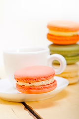 Image showing colorful macaroons with espresso coffee