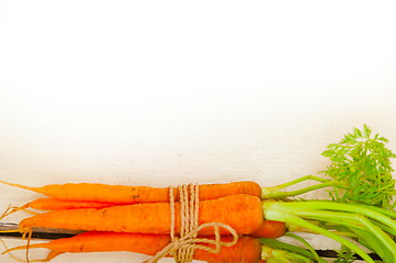 Image showing baby carrots bunch tied with rope