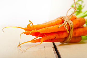 Image showing baby carrots bunch tied with rope