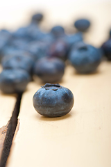 Image showing fresh blueberry on white wood table