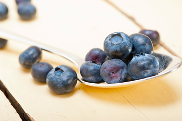 Image showing fresh blueberry on silver spoon