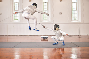 Image showing Fencing, sports and people fight, jump and training, fitness or workout for energy with epee sword in gym. Battle, fencer or athlete in performance, competition or exercise with sabre, helmet or suit