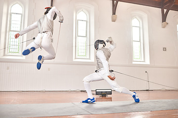 Image showing Fencing, jump and sport with sword to fight in training, exercise or workout in a hall. Martial arts, stab and fencers or people with mask and costume for fitness, competition or target in swordplay