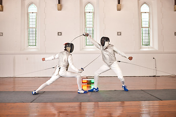 Image showing Sword, sport and men fight in fencing training, exercise or workout in a hall. Martial arts, match and fencers or people with mask and costume for fitness, competition or stab target in swordplay