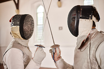 Image showing Fencing, sport and start fight with sword in training, exercise or challenge in hall. Martial arts, crossed and fencers or people with mask and costume for fitness, competition or target in swordplay