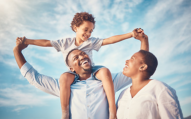 Image showing Happy, black family and parents playing with kid or child outdoors on vacation, holiday or trip and bonding together. Mother and father carrying son on shoulders with smile, excited and happiness