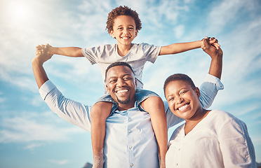 Image showing Portrait, black family and happy parents playing with kid or child outdoors on vacation or holiday and bonding together. Mother and father carrying son on shoulders with smile, excited and happiness