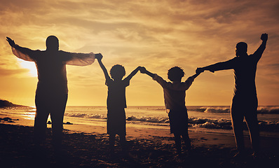 Image showing Holding hands, sunset and silhouette of a family at the beach with love, freedom and happiness. Summer, travel and back of parents with children, affection and together in the dark by the ocean