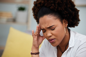 Image showing Woman, headache and stress in debt, financial crisis or burnout on sofa at home. Face of African female person with bad head pain, migraine or mental health strain from pressure or difficulty