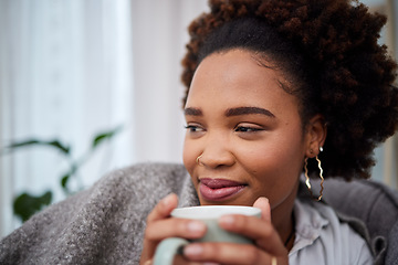 Image showing Relax, coffee and thinking with woman in living room for peace, happy and morning. Health, happiness and drinking tea with African person smile on sofa at home for caffeine, beverage and free time