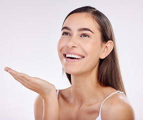 Image showing Skincare, advertising and face of woman with palm for wellness, beauty products or cosmetics. Dermatology, mockup and female person with hand gesture for natural health on white background in studio