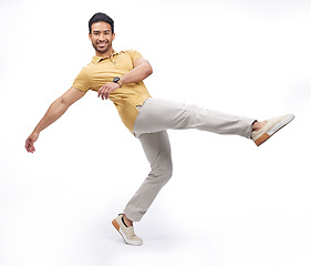 Image showing Dance, movement and portrait of man in studio for happiness, energy and performance with smile. Creative, happy and male person dancing, moving and in action pose for mockup on white background