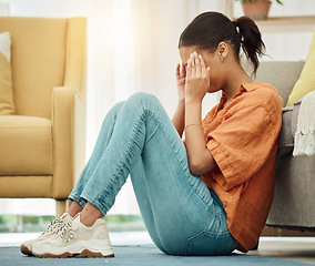 Image showing Headache, woman and stress on floor of home with anxiety, depression or ptsd of trauma. Sad girl crying in living room for worry, psychology and pain of mistake, shame and tired of mental health risk