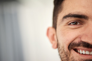 Image showing Happy, half face and portrait of a man with a smile for a positive mindset with mockup space. Happiness, excited and young handsome male person with confidence by mock up for advertising or marketing