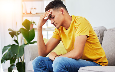 Image showing Tired, stress and student with man on sofa for pain, burnout and headache. Fatigue, mental health and frustrated with male person thinking in living room at home for anxiety, exhausted and migraine