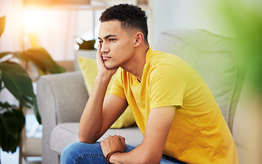 Image showing Thinking, man and home sofa with stress and depression in living room feeling bored and frustrated. Sad, grief and mental health of male person on a couch with anxiety and tired from concerns of fail