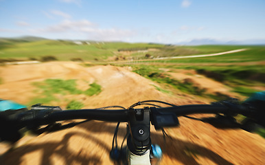 Image showing Cycling, sports and person with bars on bicycle for adrenaline on adventure, freedom and speed. Mountain bike, fast blur and cyclist for training, exercise and fitness on dirt road, trail or track