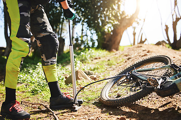 Image showing Sports, air and pump with person and mountain bike in nature for repair, cycling and maintenance. Inspection, cardio and fitness with closeup of cyclist in forest for challenge, journey and training