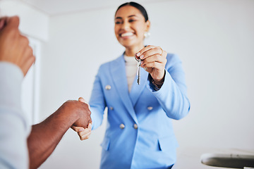 Image showing Moving in, house keys and female realtor shaking hands for congratulations with homeowner clients. Happy, real estate and young woman agent doing a professional agreement handshake with people.