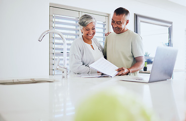 Image showing Happy senior couple, paperwork and laptop for finance, budget or planning expenses together at home. Elderly man and woman smile in happiness on computer for financial documents, bills or mortgage