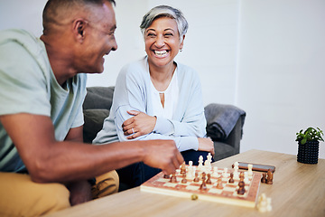 Image showing Senior couple, playing chess and home for thinking, strategy or mindset with excited smile, relax or bonding. Elderly woman, man and sofa for board game, ideas or brainstorming for challenge in house