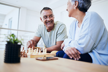 Image showing Senior couple, playing chess and happy for thinking, strategy or mindset with excited smile, relax or bonding. Elderly woman, man and sofa for board game, idea or moving for win, challenge and home