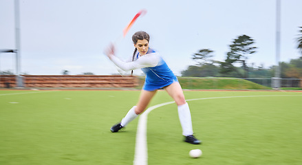 Image showing Sports, hockey and female athlete training for a game, match or tournament on an outdoor field. Fitness, exercise and young woman playing at practice for strategy with a stick and ball at a stadium.