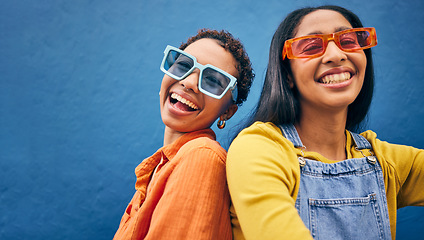 Image showing Sunglasses, fashion and portrait of friends on blue background with trendy clothes, accessories and style. City, summer clothes and face of happy women with smile on holiday, vacation and weekend