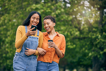 Image showing Phone, friends and women in park with coffee together for holiday, bonding and quality time outdoors. Friendship, happy and female people walking in nature for relaxing, conversation and social media