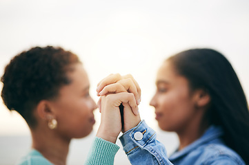 Image showing Holding hands, lesbian and queer couple with love, outdoor and romance with support, bonding and quality time. Closeup, fingers and women with holiday, romantic and loving together with Lgbtq people