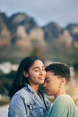 Image showing Outdoor, hug and queer couple with love, marriage and happiness with romance, lesbians and relationship. Lgbtq, female people or women on a holiday, vacation and quality time with sunset and embrace