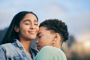 Image showing Happy, hug and queer couple with love, care and happiness with marriage, sunset and relationship. Lgbtq, female people or women on a holiday, smile and quality time with freedom and romance with joy