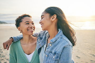 Image showing Beach, hug and queer couple with love, lesbian and happiness with marriage, romance and relationship. Lgbtq, female people or women on a seaside holiday, vacation and quality time with sunset and joy