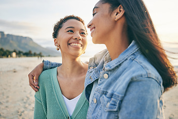 Image showing Beach, hug and queer couple with love, lgbtq and happiness with marriage, sunset or adventure. Lesbian, female people or women on a seaside holiday, vacation or quality time with a journey or embrace