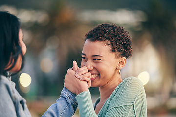 Image showing Holding hands, happy and a lesbian couple in the city with love, excited and support together. Laughing, smile and women in a young lgbt relationship with trust, comic and kindness on a date