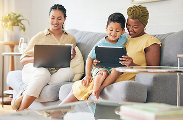 Image showing Laptop, tablet and happy family child, mom or bisexual people reading online info, e learning and remote education. Tech app, lesbian mothers and relax gay woman teaching kid on home living room sofa