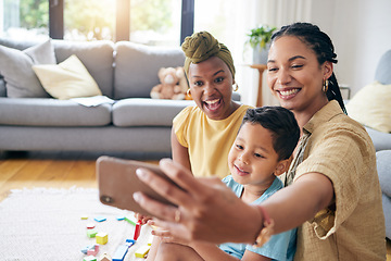 Image showing Lesbian, women and son in family selfie, smile or care with toys, post or web blog on floor in home living room. Mother, male kid and happy for love, bonding or memory for social network app in house