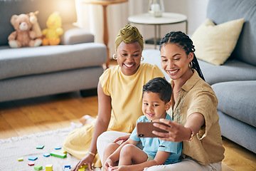 Image showing Lesbian, women and son in home for selfie, smile or care with toys, post or blog on floor in living room. Mother, male kid and happy for gay love, bonding and memory on social network in family house