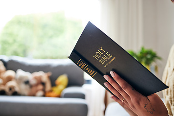 Image showing Closeup, bible and hands in home for faith, studying religion or mindfulness with holy spiritual scripture. Christian literature, reading and ethics for knowledge, language or woman with Jesus Christ