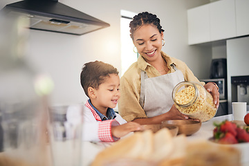 Image showing Breakfast, smile and a mother and child cooking, baking or helping with food in the kitchen. House, eating and a boy kid and a young mom teaching during lunch or for dinner together while hungry