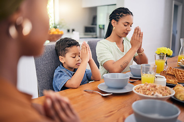 Image showing Praying, breakfast and morning with family at table for food, worship or religion. Prayer, gratitude and grace with parents and child in dining room at home for Christian, spiritual or faith together