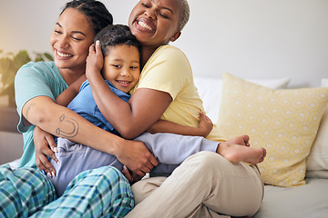 Image showing LGBT, bedroom hug and happy family, child and relax mothers bonding, support and enjoy quality time together. Home, care and gay people, homosexual parents or lesbian women embrace young kid on bed