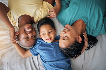 Image showing Child, LGBT family and happy on bed in home bedroom for security, quality time and love. Adoption, lesbian or LGBTQ women or parents with a foster kid for care, fun and relax in morning from above