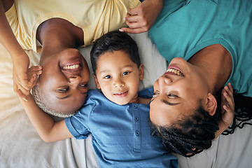 Image showing LGBT family, child and happy portrait on bed in home bedroom for security, quality time and love. Adoption, lesbian or gay women or parents with a foster kid for care or relax in morning from above