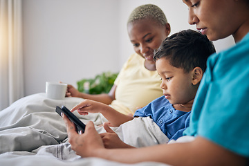 Image showing Tablet, bed and gay mother, child and bisexual people reading online story, digital information and home ebook. LGBTQ, streaming video and queer mom, family or parents storytelling for kid in bedroom