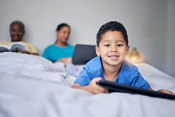 Image showing Kid, tablet and smile portrait in bed at family home in the morning with parents feeling relax in living room. Bedroom, education app and house with a young child online with mother and kids website